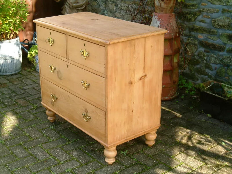 Image of right side of old pine chest