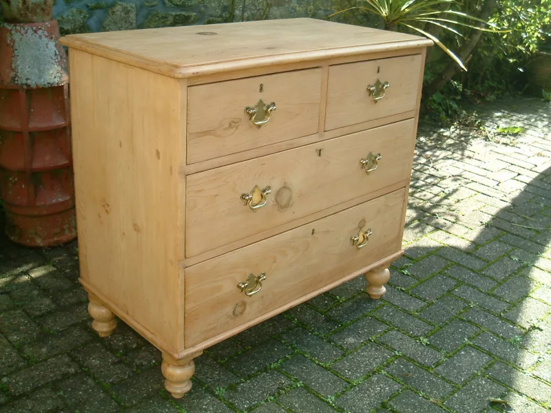 Image of left side of antique pine chest