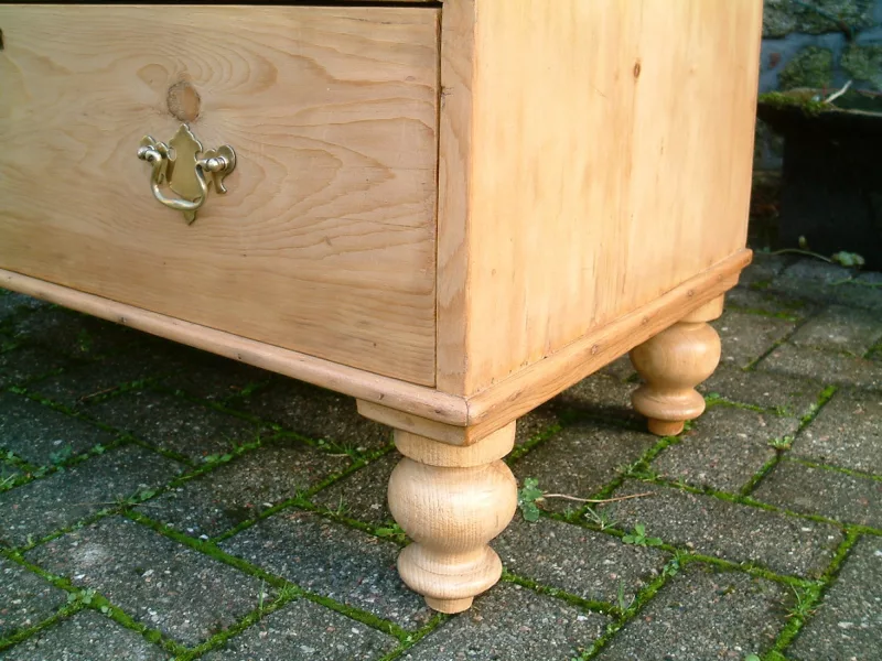 Image of turned supports on the antique pine chest of drawers