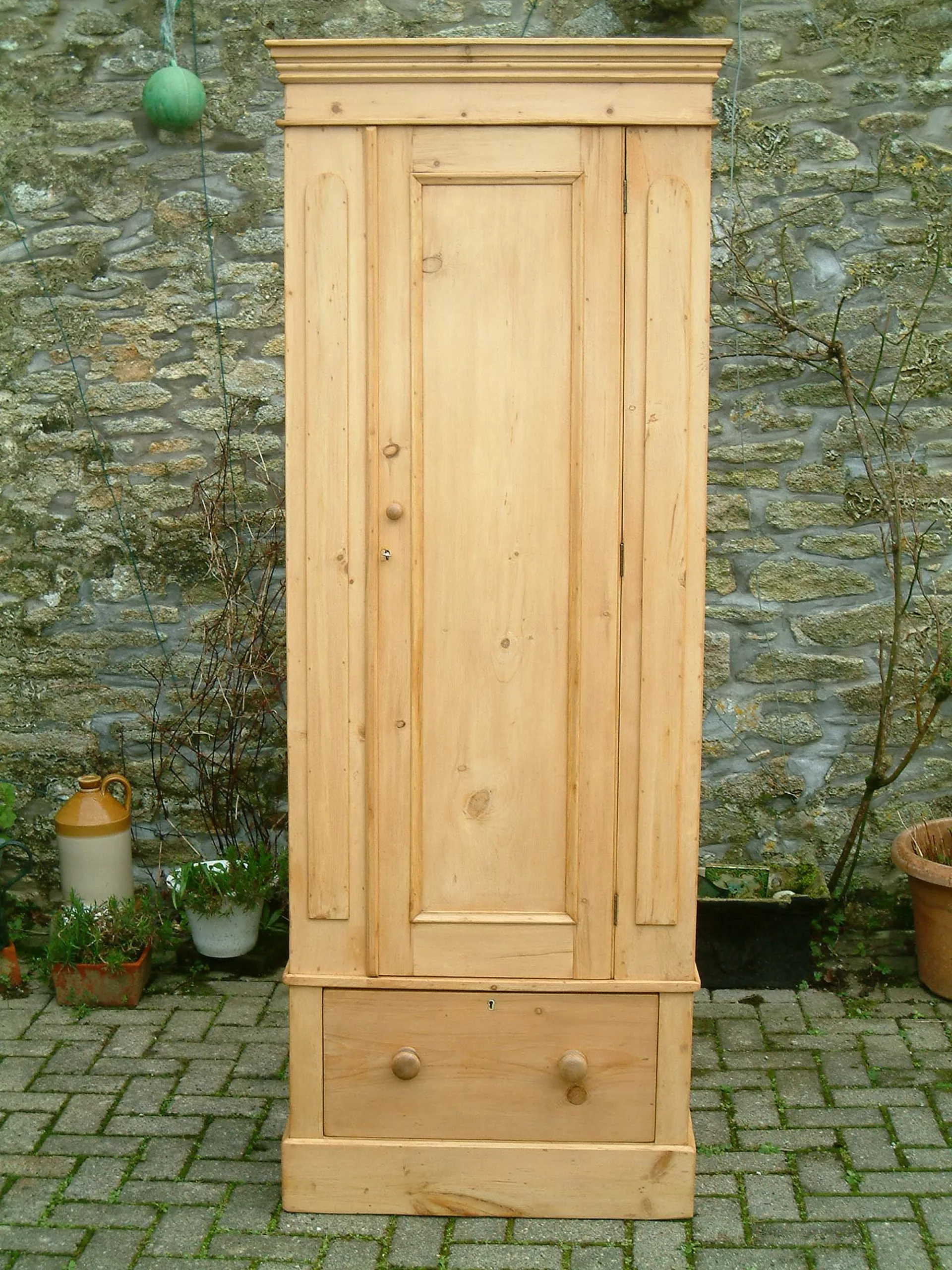 Close image of front of antique pine wardrobe