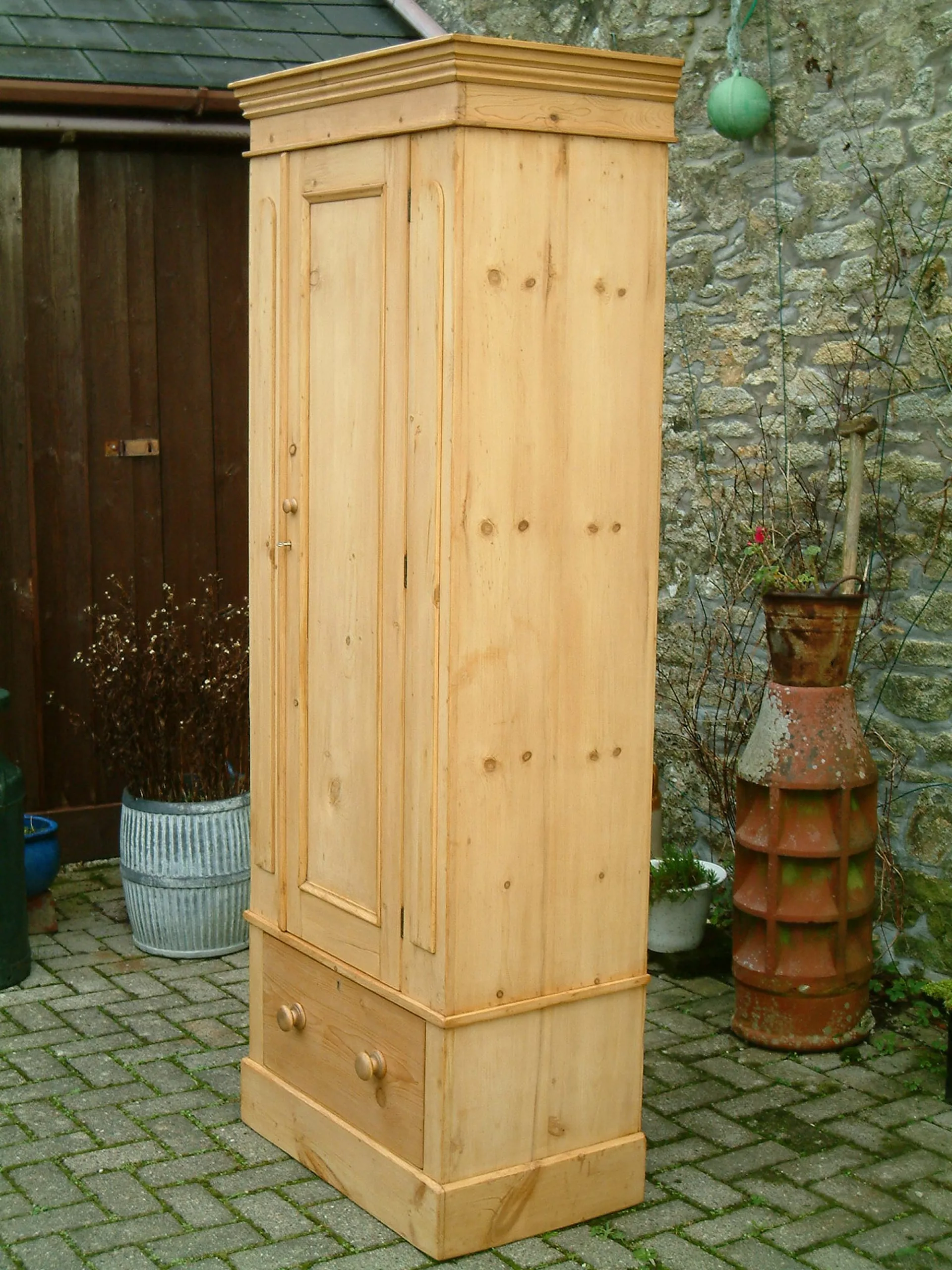 Right side of old pine wardrobe