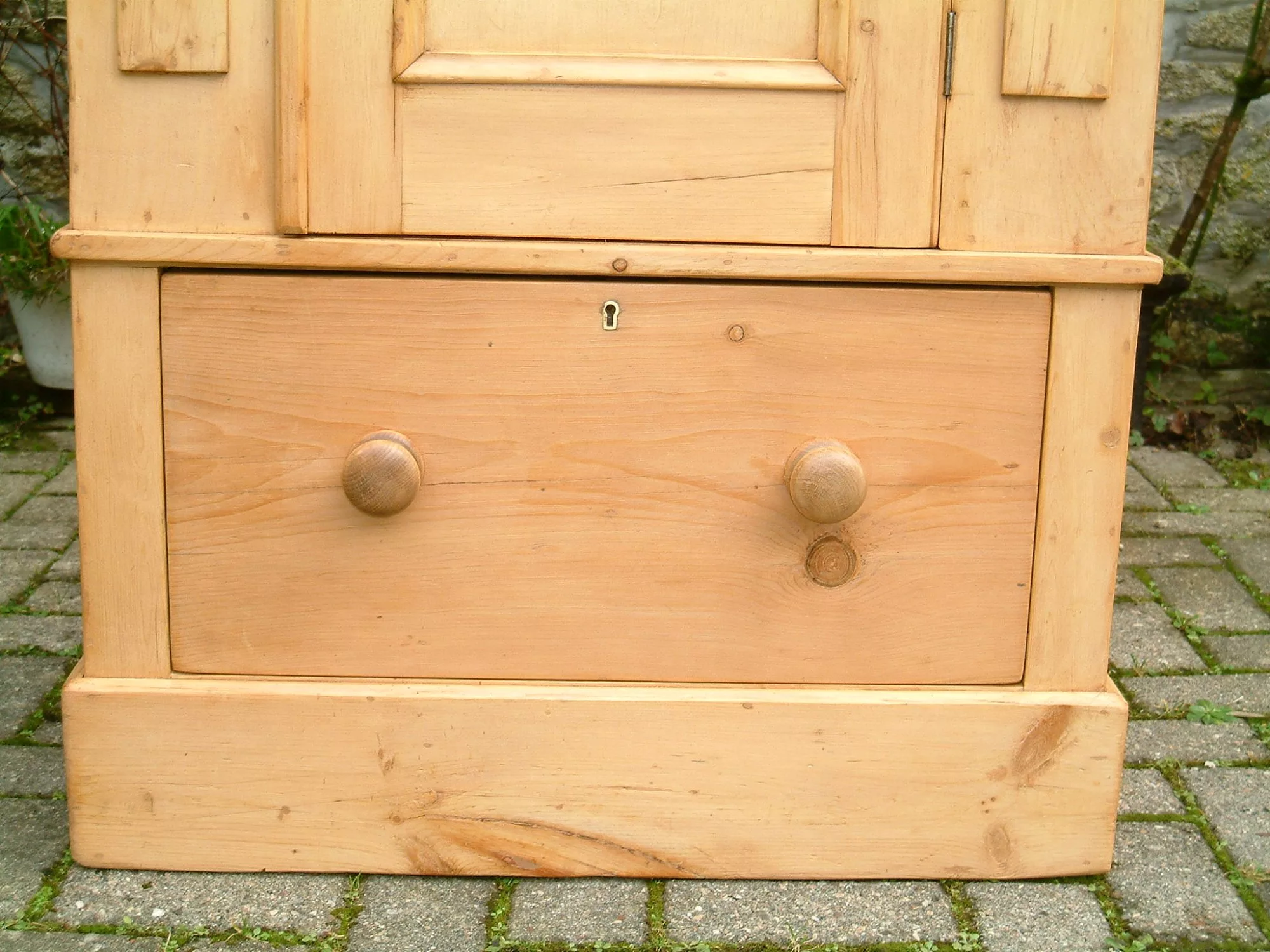 image showing base of antique pine wardobe