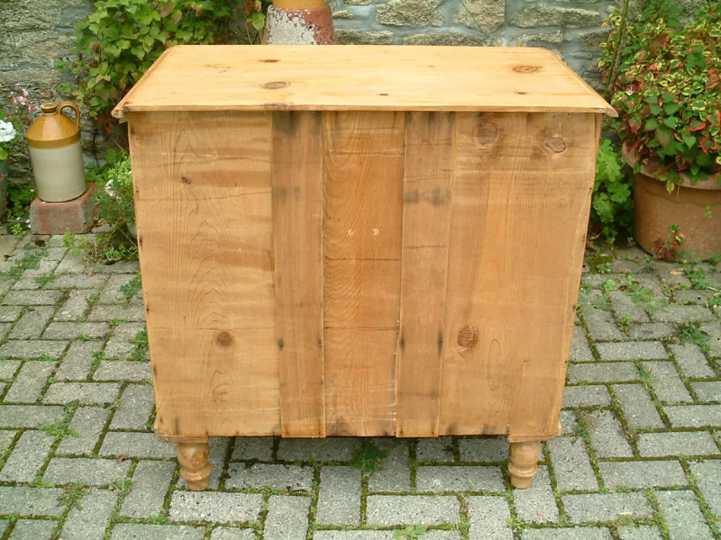 Image of the panelled back on the old pine chest