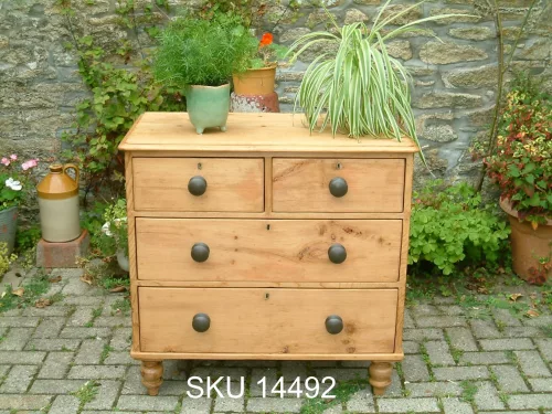 Front image of the Victorian pine chest, with floral decoration