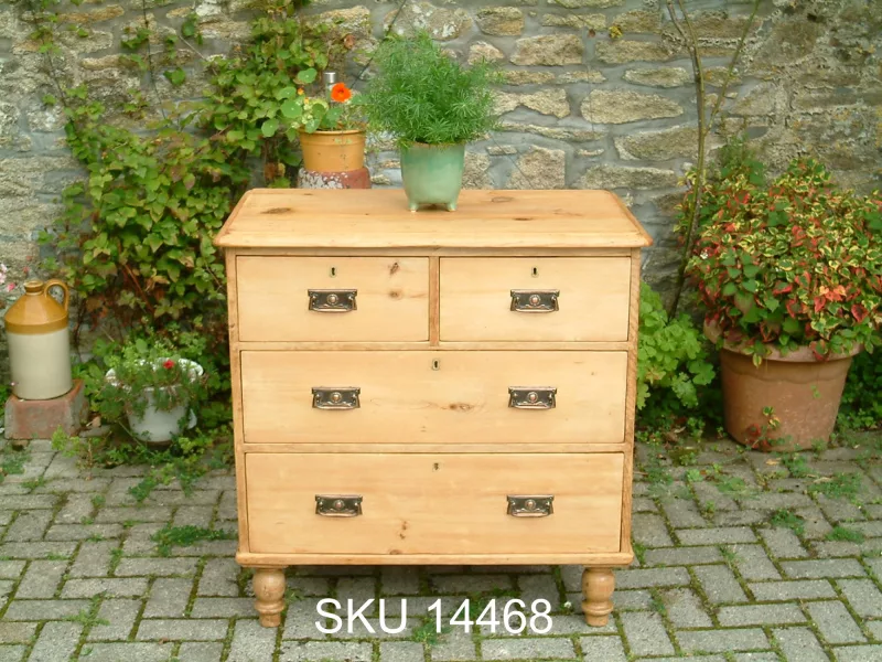 Front view of the Victorian pine chest of drawers, with floral decoration