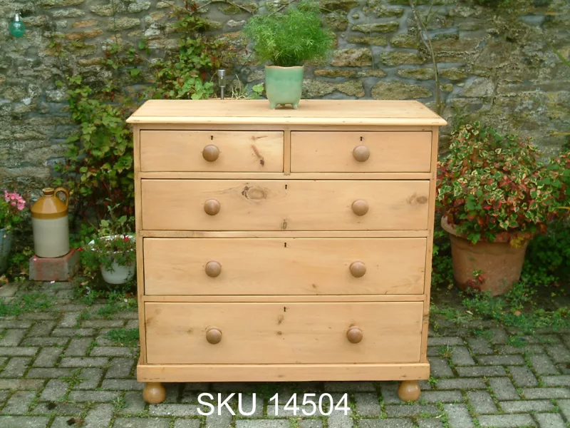 Front image of the antique pine chest, with floral decoration.
