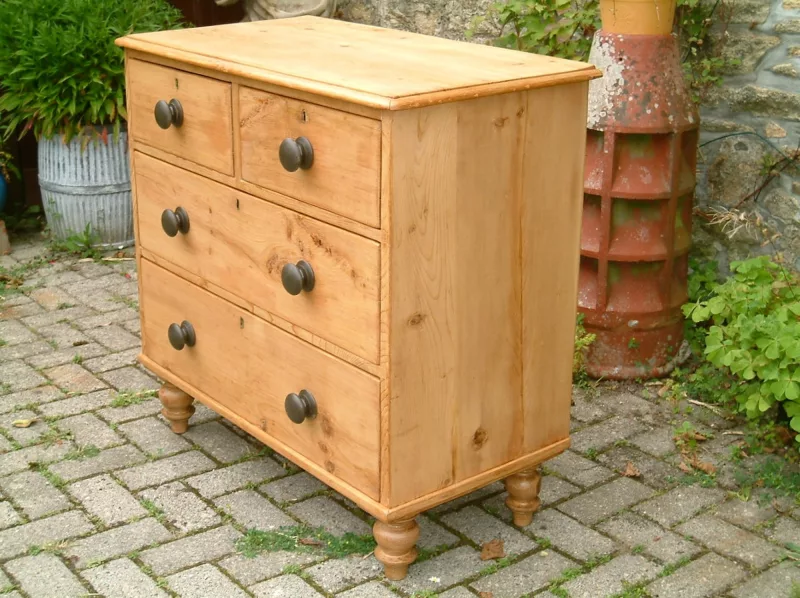 Image of the left side of antique pine chest