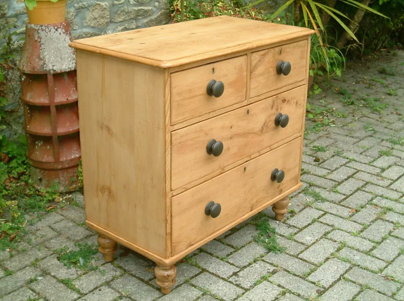 Image of the right side of the vintage pine chest of drawers