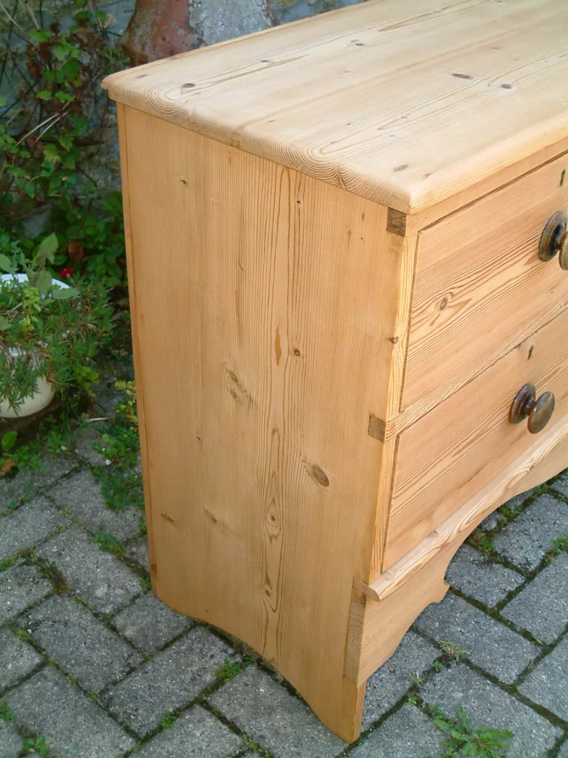 Image of the left hand side of the antique pine chest of drawers