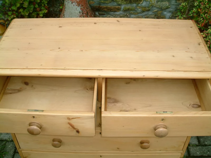 Image of the top drawers open on the antique pine chest of drawers.