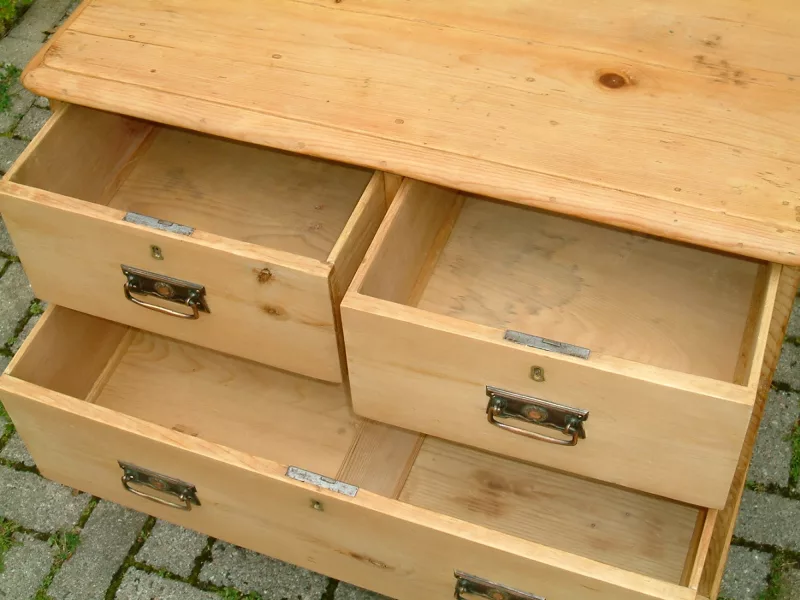 Close image of the top sets of drawers open on the Victorian pine chest of drawers
