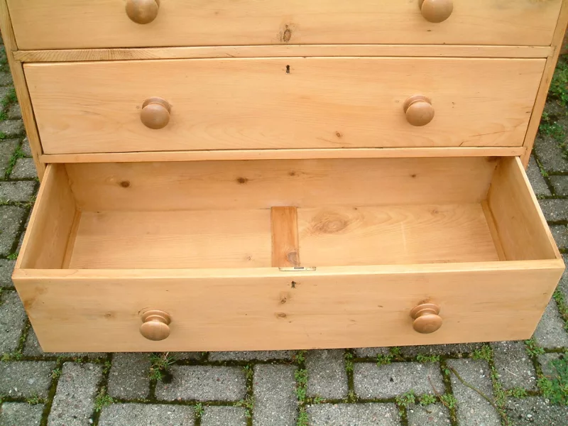 Image of the base drawer open on the Victorian pine chest
