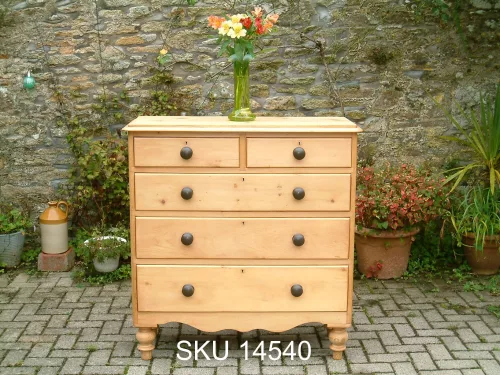 Front view of the Victorian pine chest of drawers with floral decoration