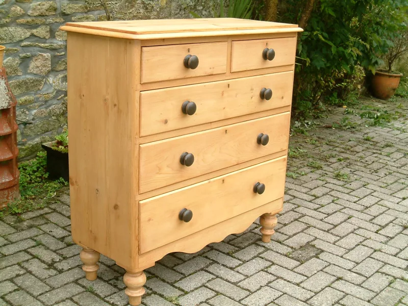 Image of the left side and front of the old pine chest of drawers