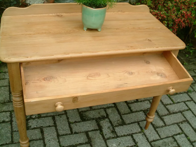 Image of the drawer open on the antique pine side table