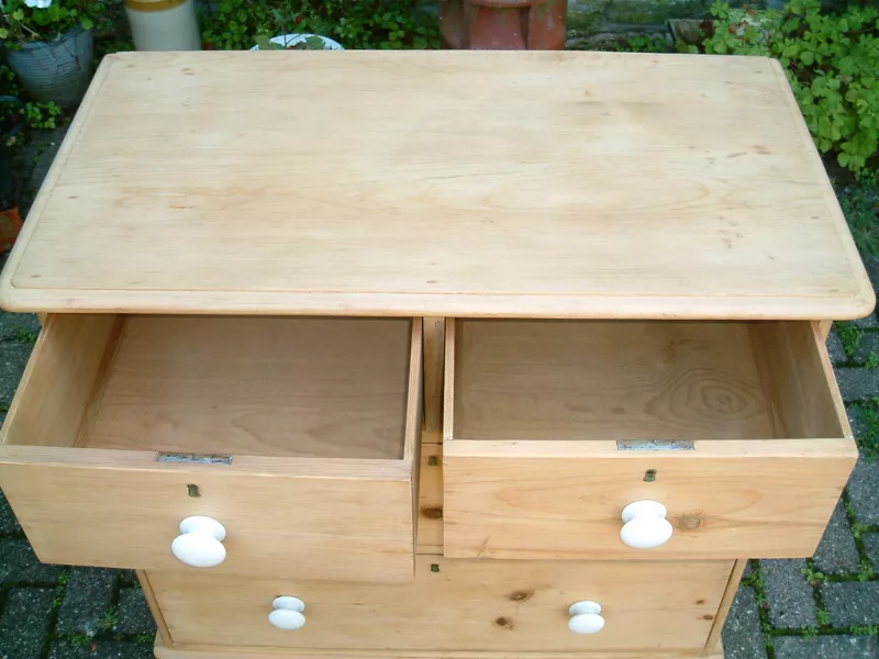 Image of the top of the antique pine chest of drawers with the top drawers open