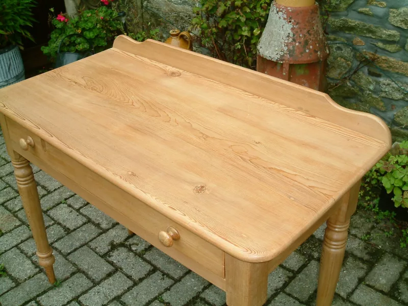 Image of the clean top of the old pine side table