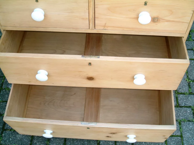Image of the bottom drawers open on the old pine chest