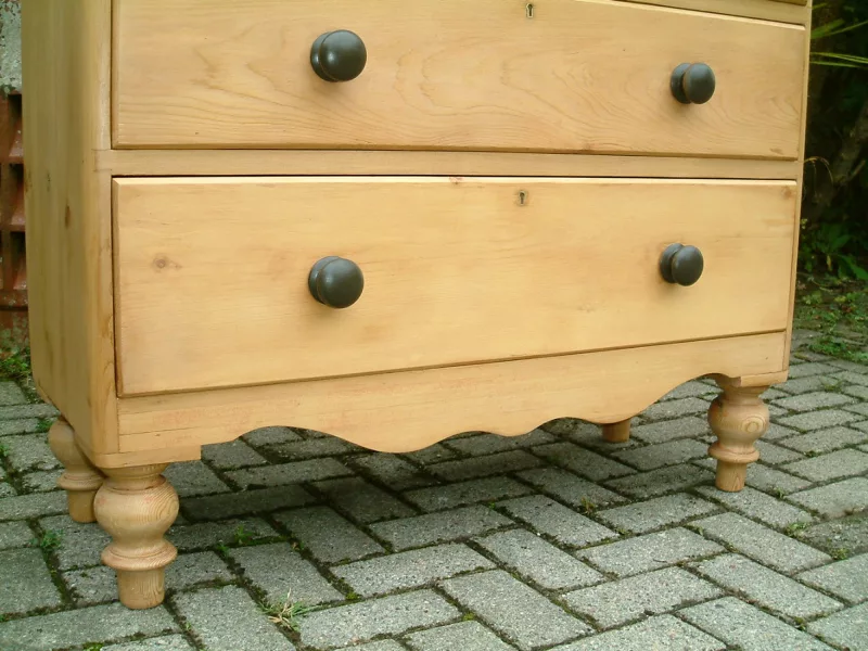 Image showing the apron and turned supports on the Victorian pine chest of drawers