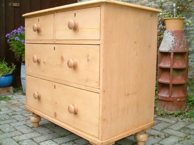 Image capturing the front and side of the old pine chest.