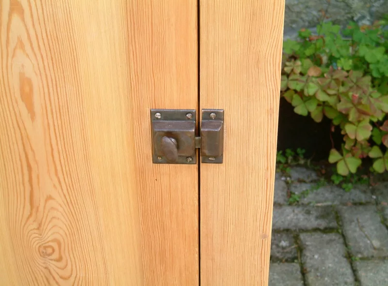 Image of the original catch on the restored old pine cupboard