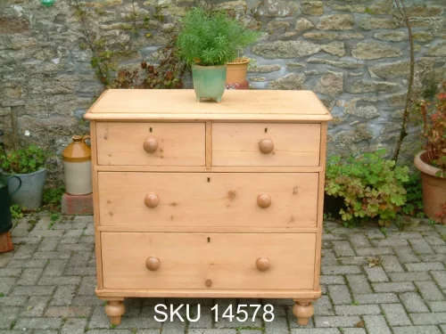 Front image of the Victorian pine chest of drawers, with floral decoration