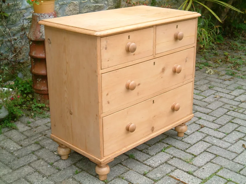 Image of the front and left side of the vintage pine chest of drawers