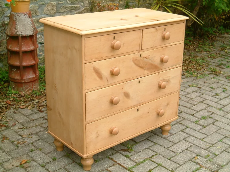 Image of the left and front of the vintage pine chest of drawers