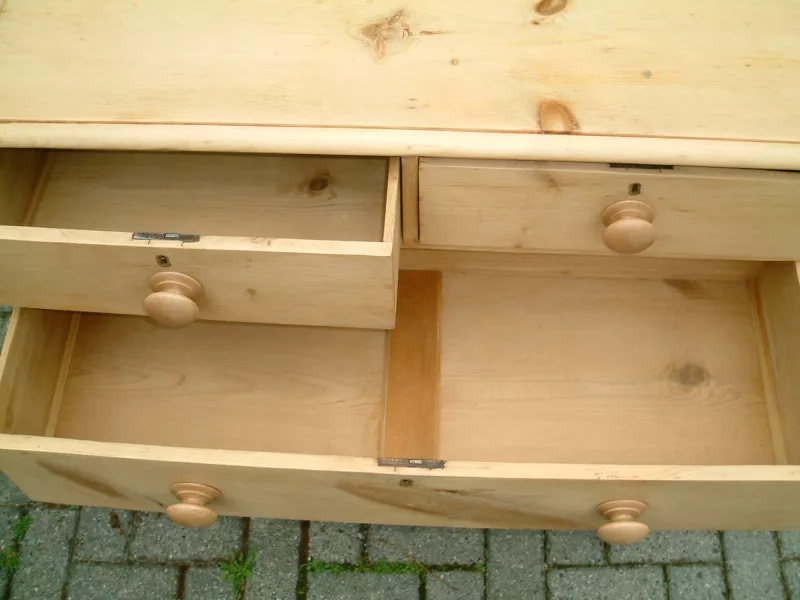 Image of the top drawers open, showing timber bases on the antique pine chest of drawers.
