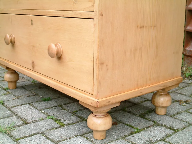 Image showing the large tulip feet fitted to the Victorian pine chest of drawers