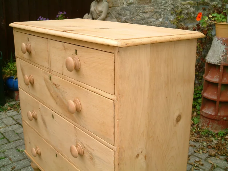 Image of the top bead on the antique chest of drawers.