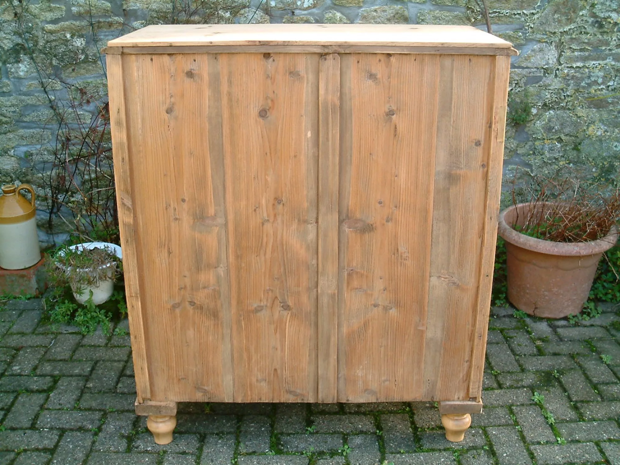 Image of the fine panelled back on the old pine chest of drawers