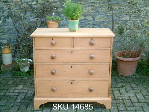 Front image of the Georgian pine chest of drawers, with floral decoration