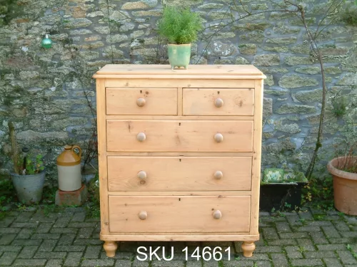 Front image of the Victorian pine chest of drawers, with floral decoration