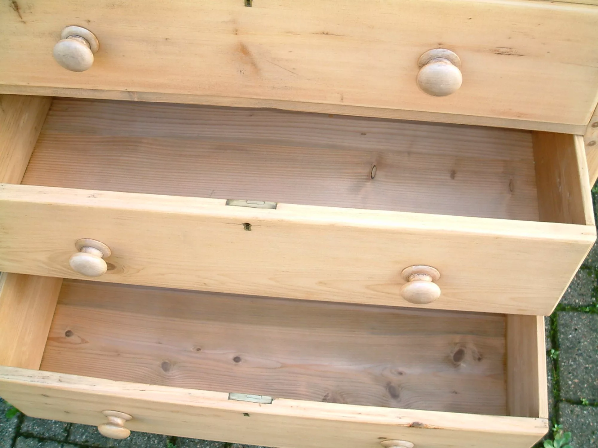 Image of the bottom drawers open on the Victorian pine chest pf drawers