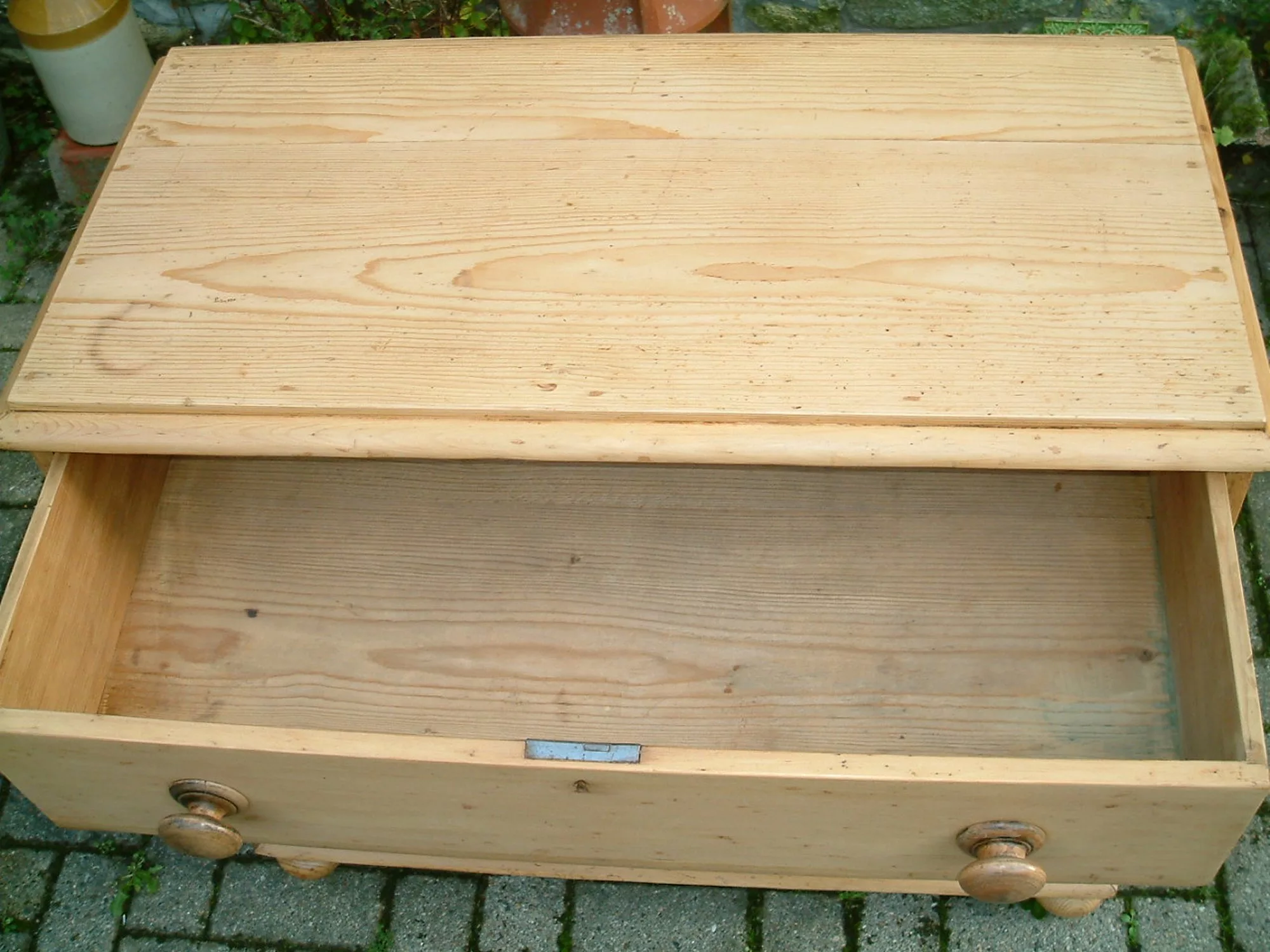 Image of the top drawer open on the Victorian pine chest of drawers