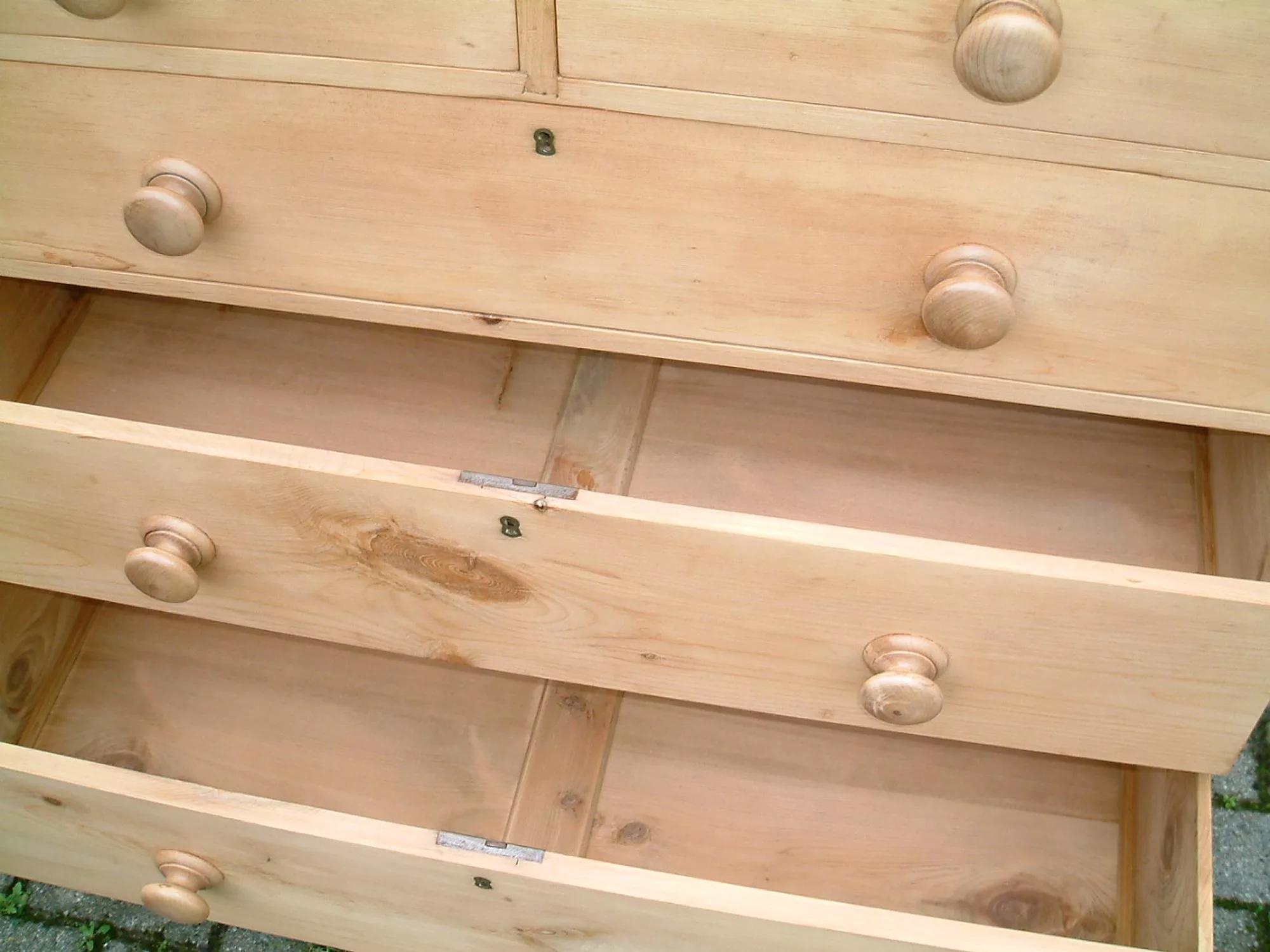 Image of the lower drawers open on the antique pine chest