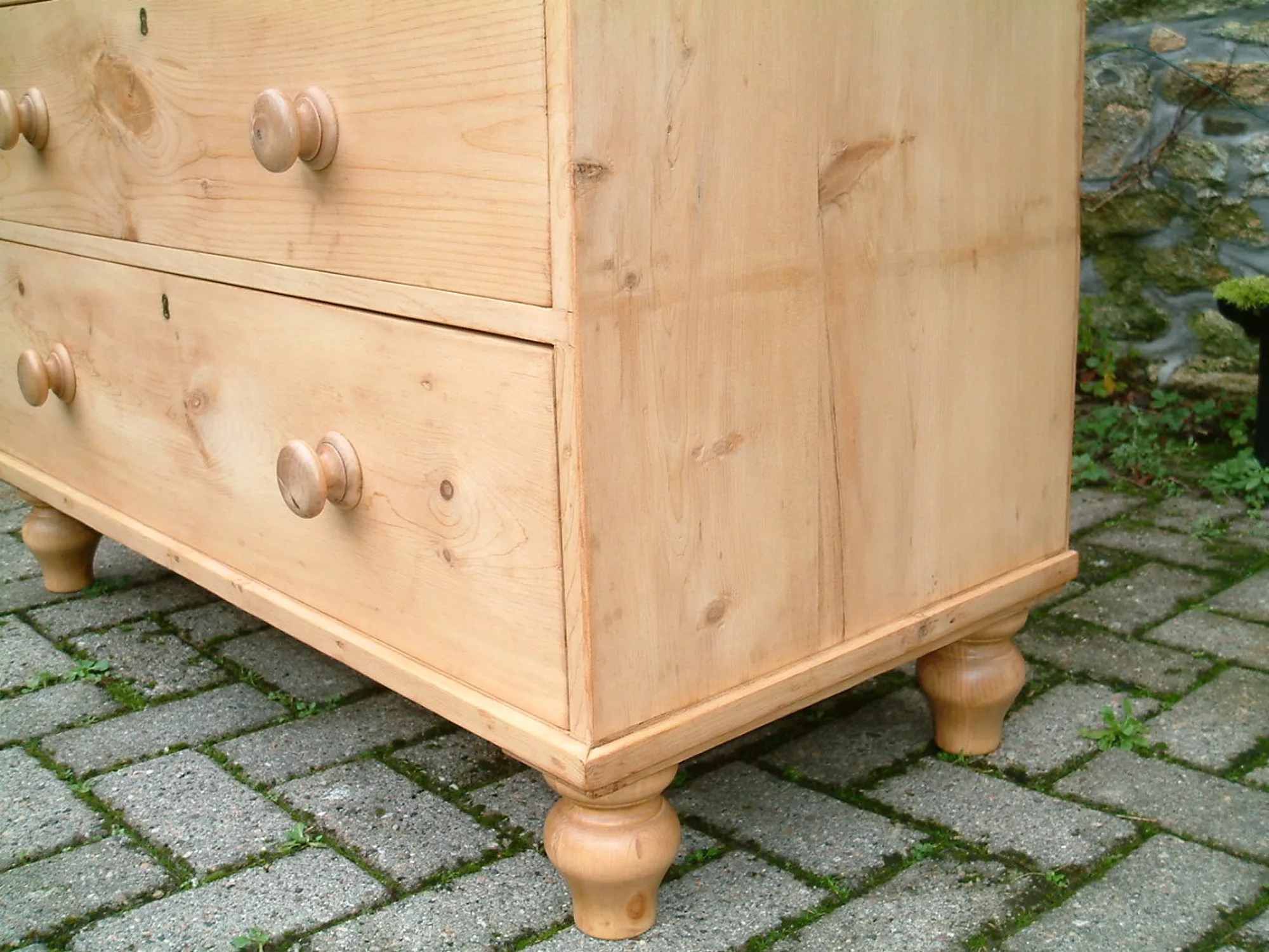 Image of the tulip feet fitted to the old pine chest
