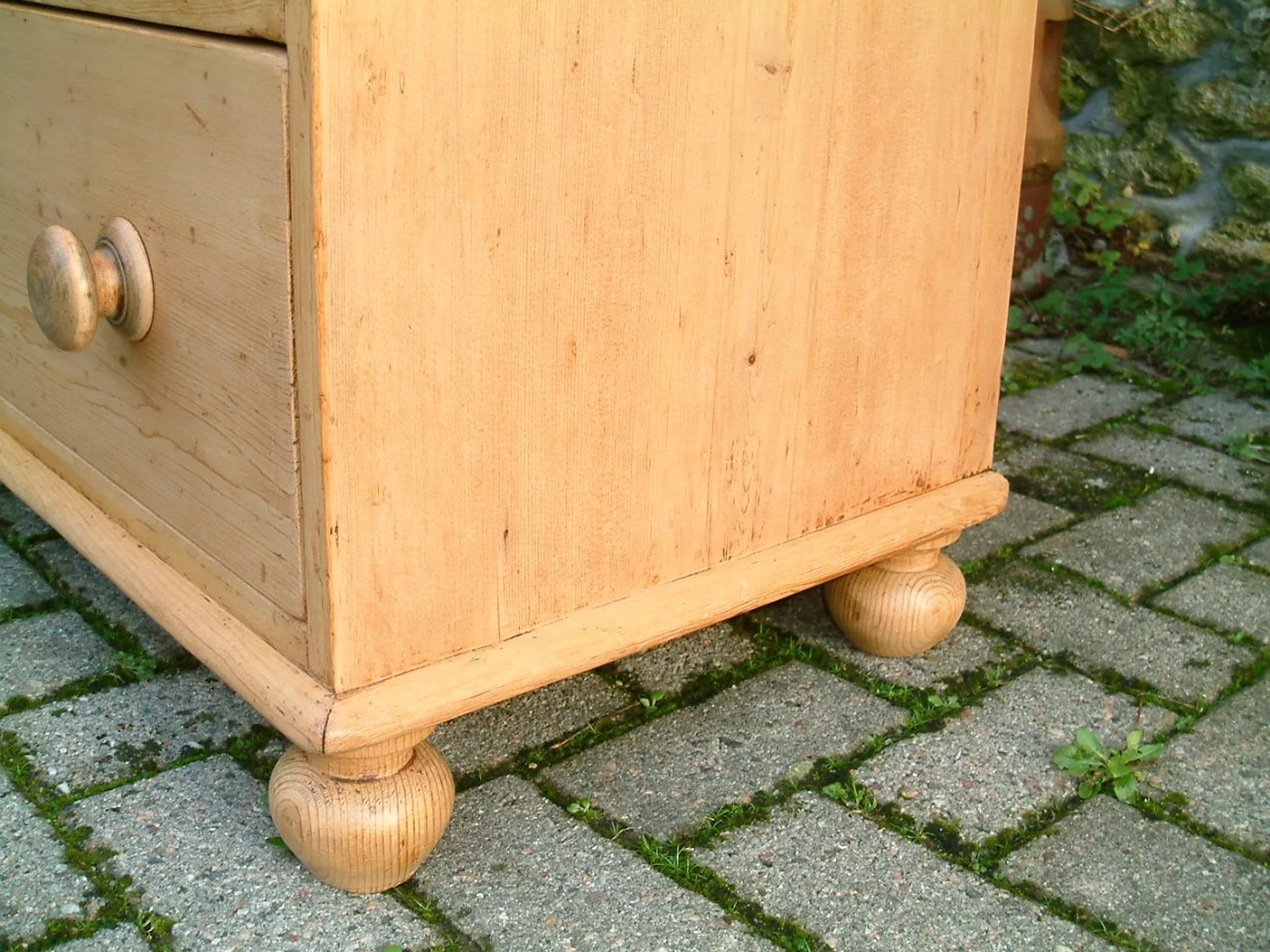 Image of the turned supports on the antique pine chest of drawers