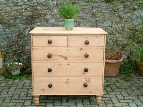 Front image of the Mid-Victorian pine chest of drawers.