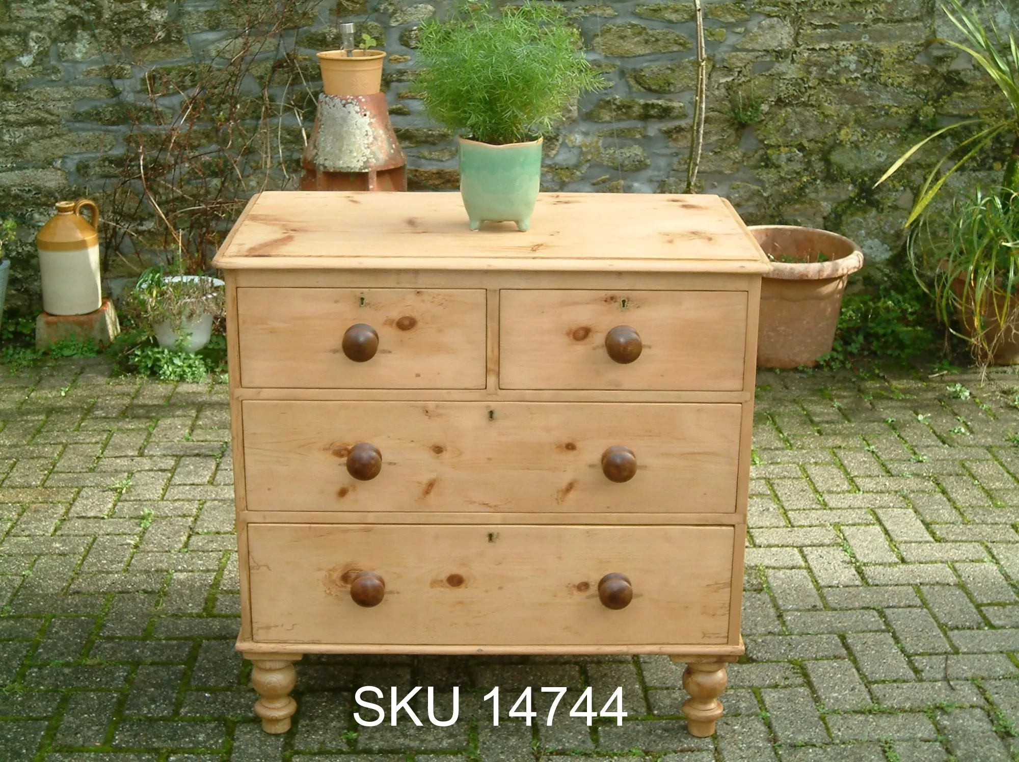 Front image of the Victorian pine chest of drawers, with floral decoration.