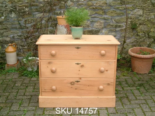 Front image of the old pine chest, with floral decoration.