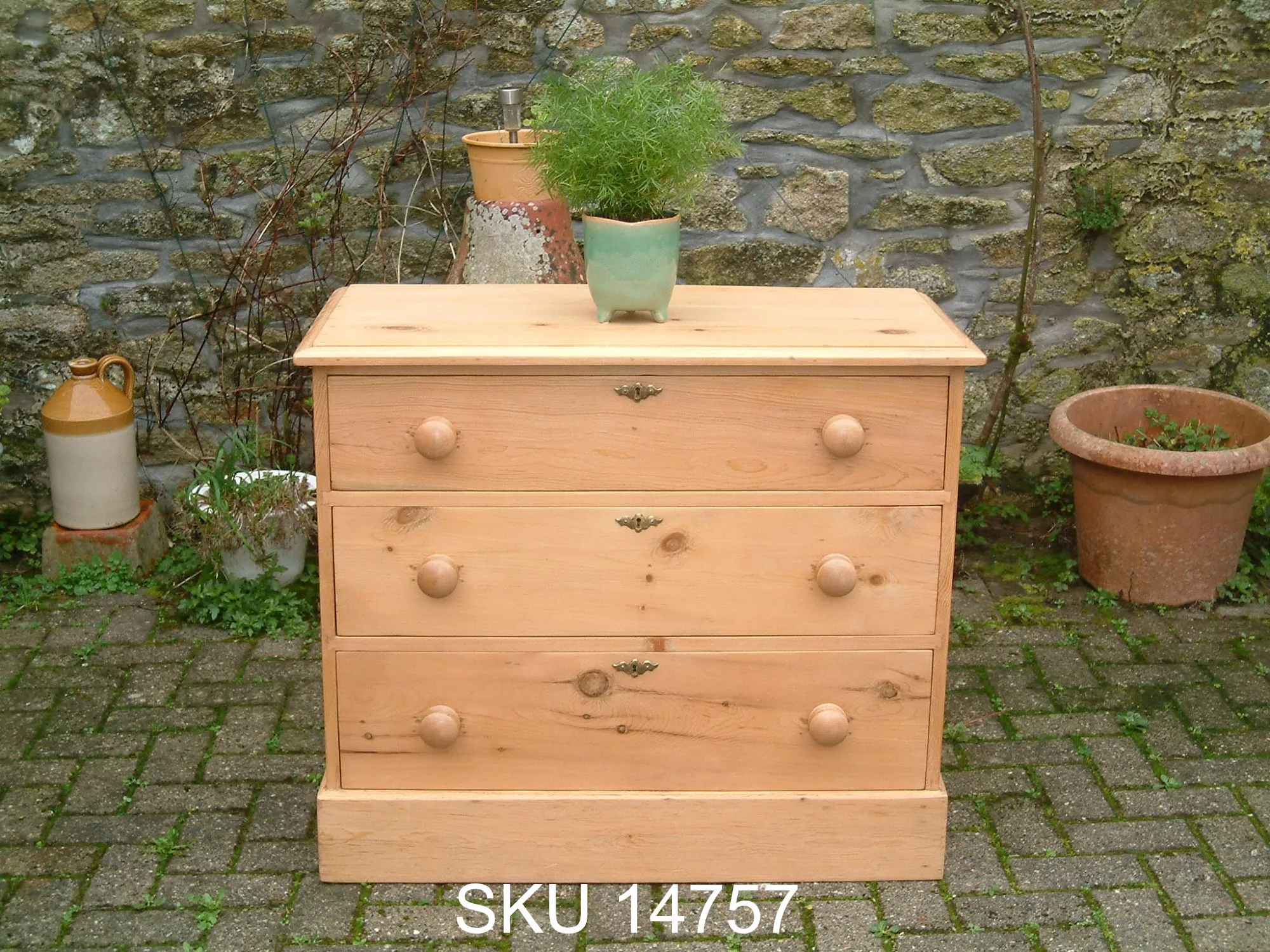 Front image of the old pine chest, with floral decoration.