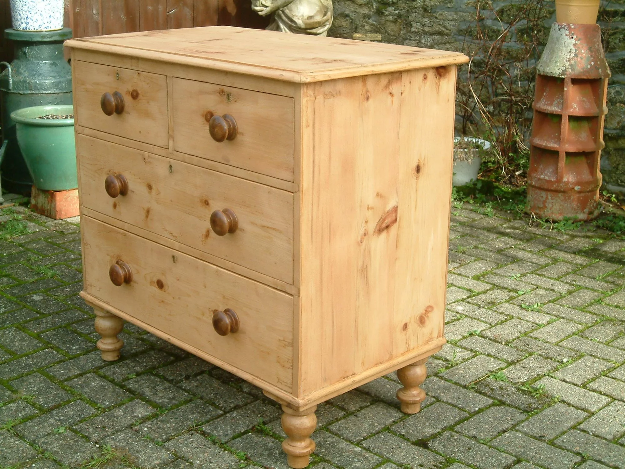 Image of the right side of the antique pine chest of drawers
