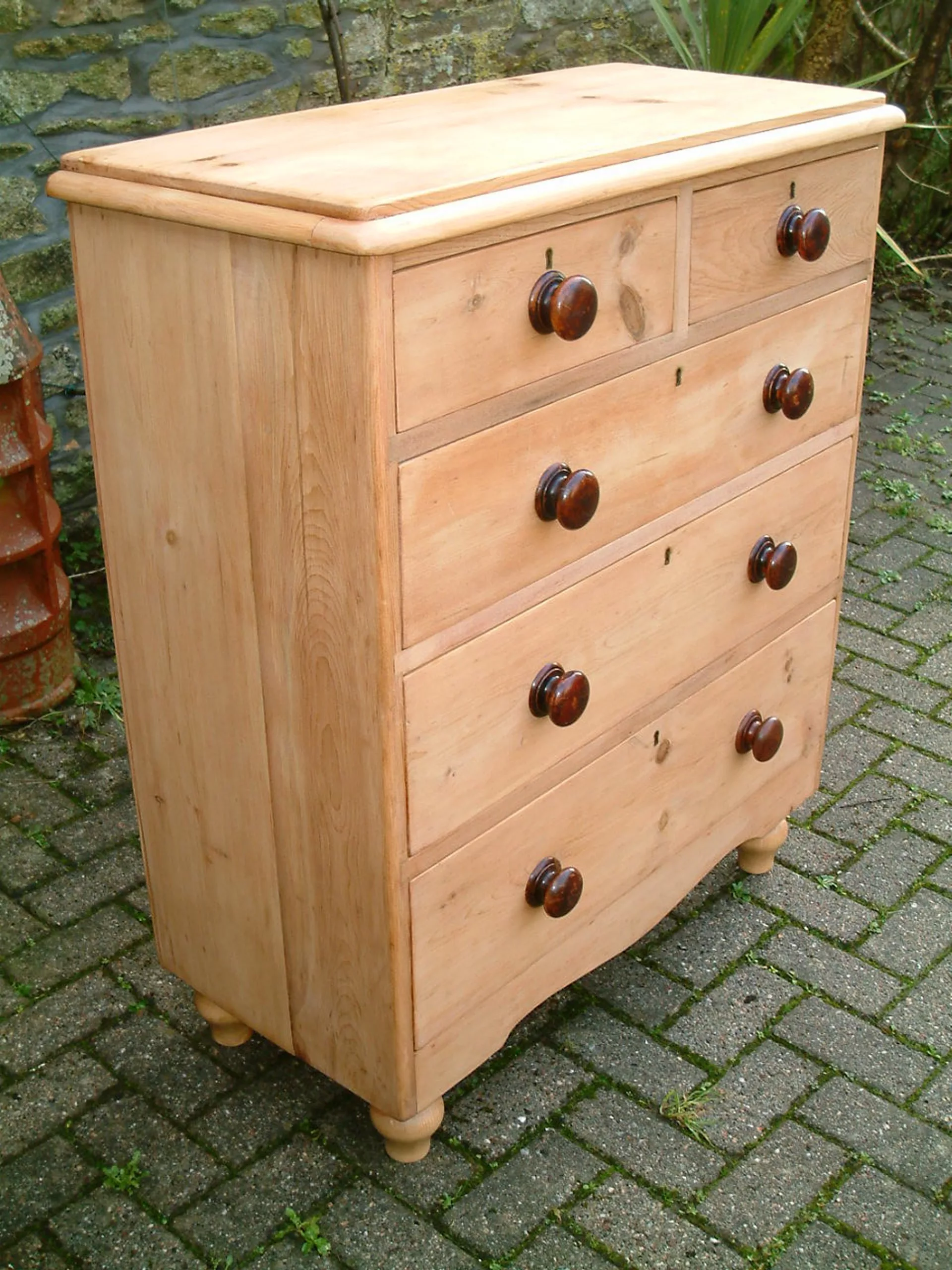 Image of the left side of the Victorian pine chest of drawers