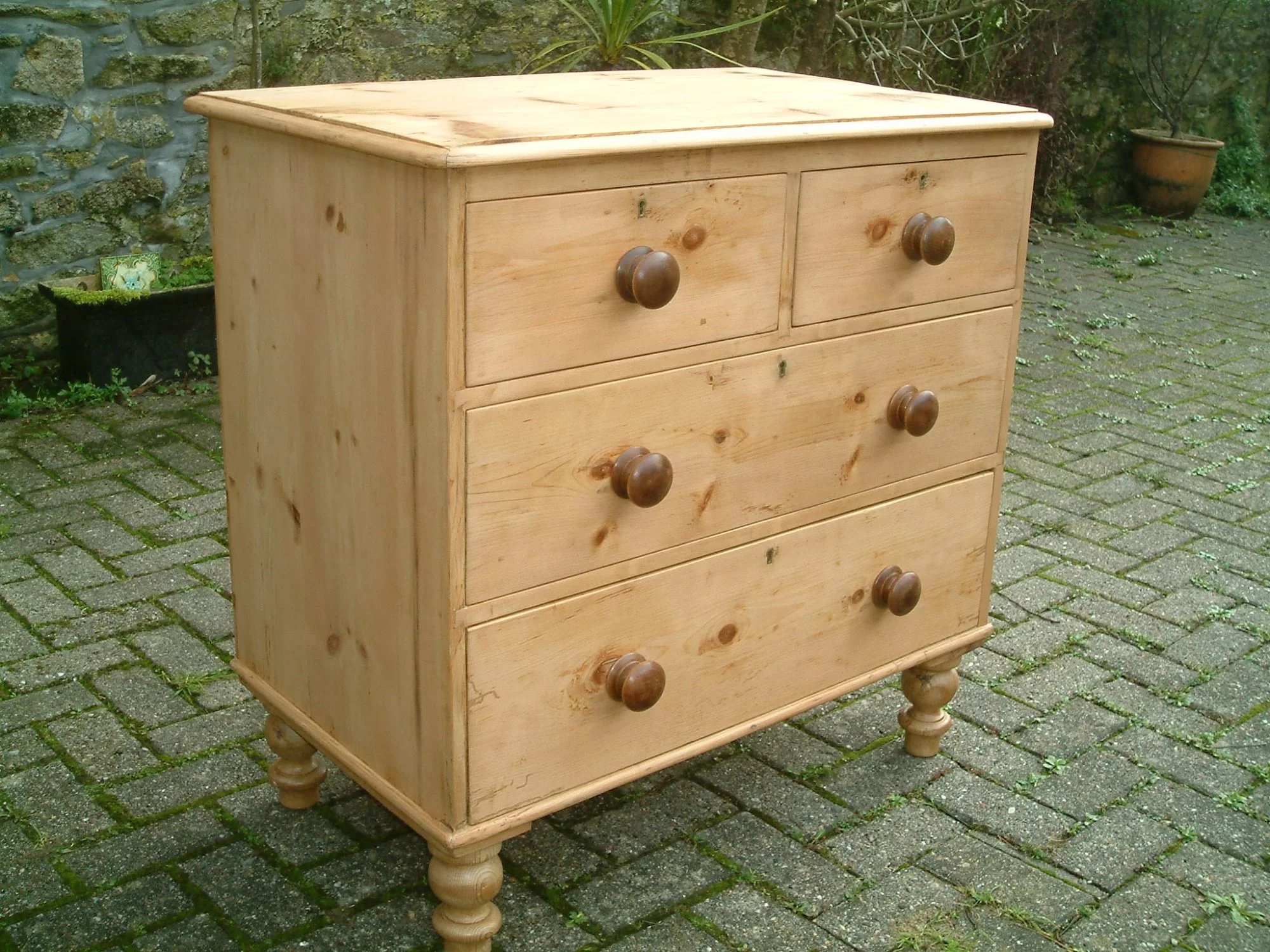 Image of the left side of the vintage pine chest of drawers