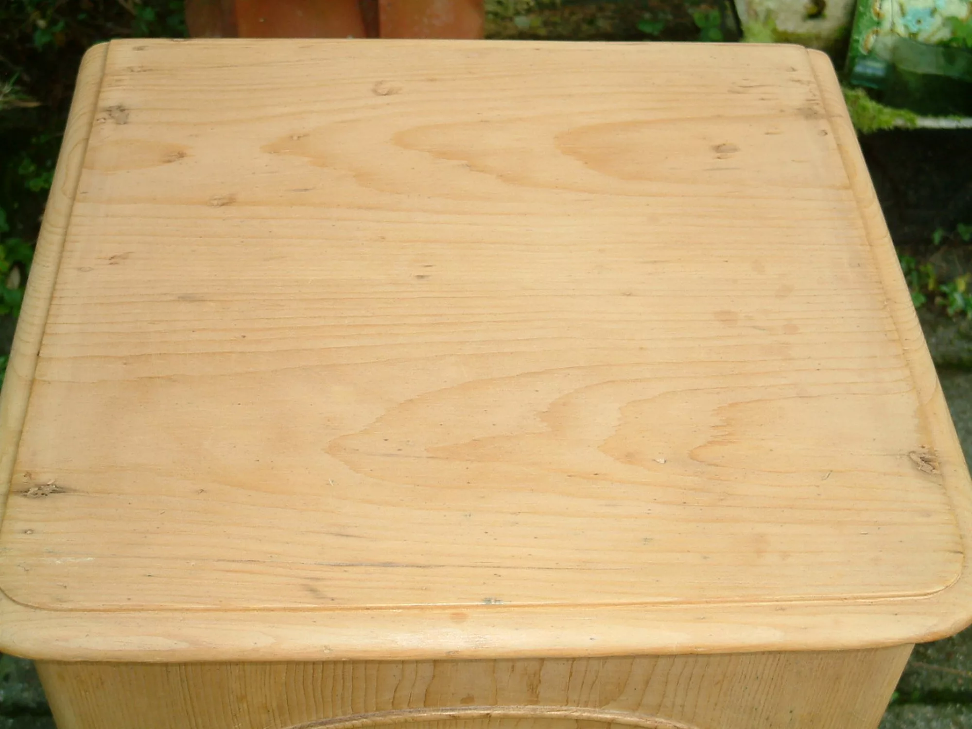 Image of the clean top on the antique pine bedside chest
