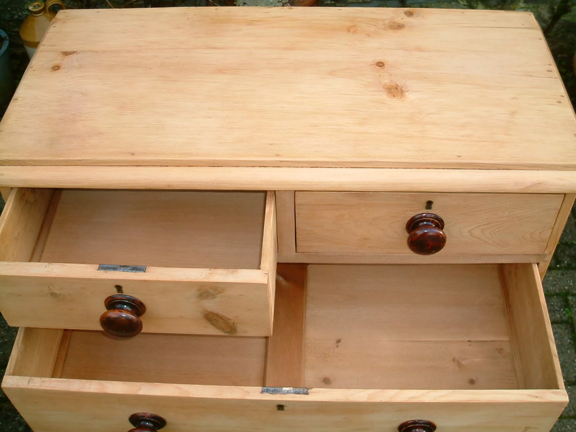 Image of the top drawers open showing drawer bases on the old pine chest