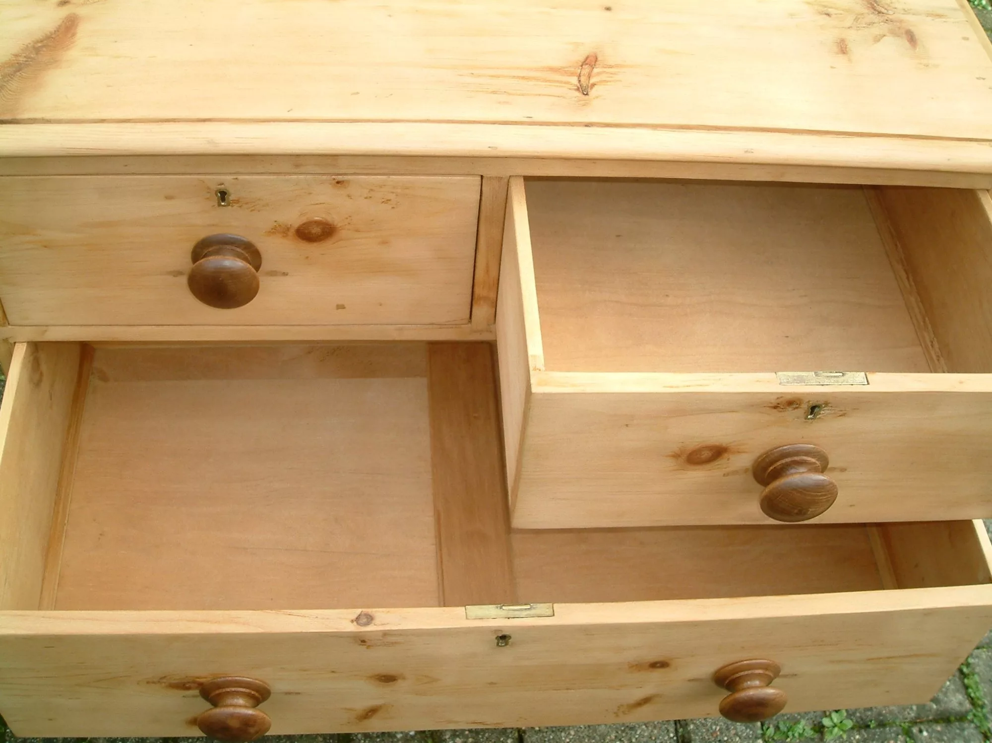 Image of the top drawers open showing drawer liners, on the Victorian pine chest