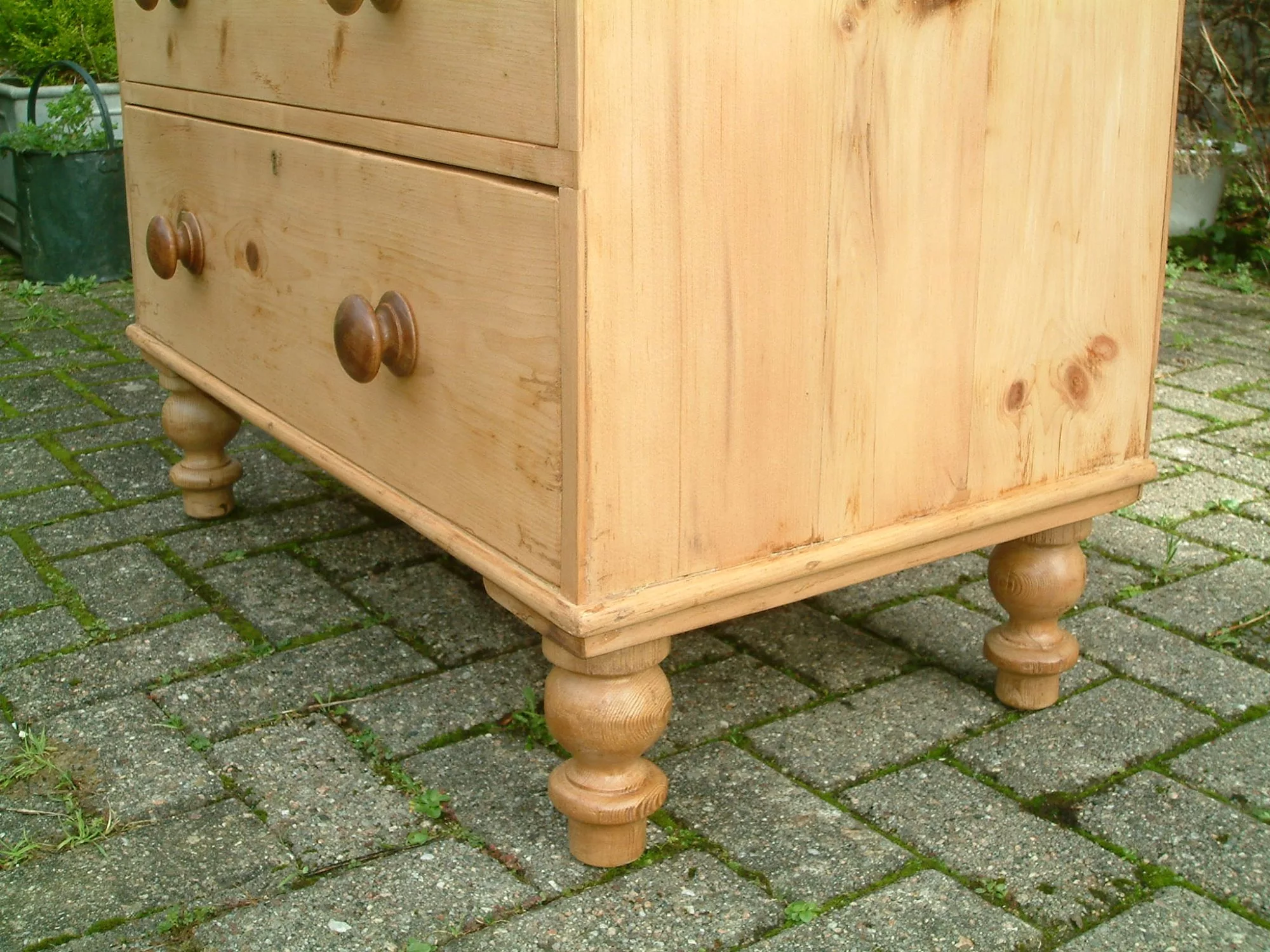 Image of the turned supports on the old pine chest of drawers